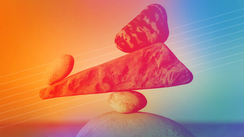 Carefully balance rock formation illustrates the need to balance ux design and research activities.