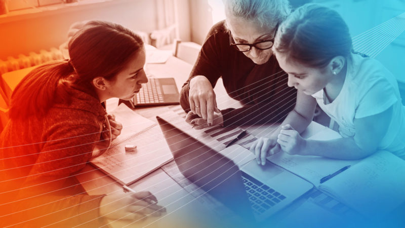 A mom and two daughters using EdTech software during the COVID-19 outbreak.