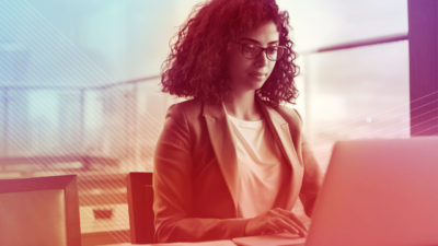 An L&D manager works on a corporate learning platform.
