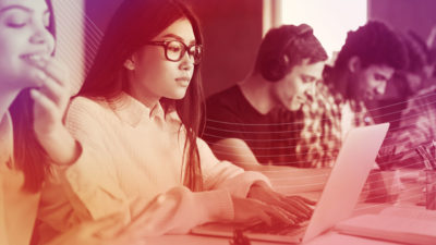 A young female student uses educational software in the classroom.