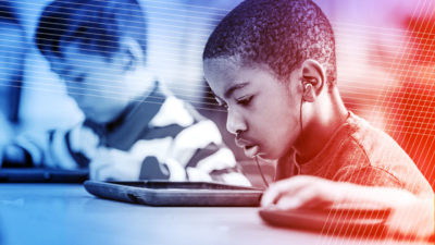 Photo of grade school student using e-learning software.