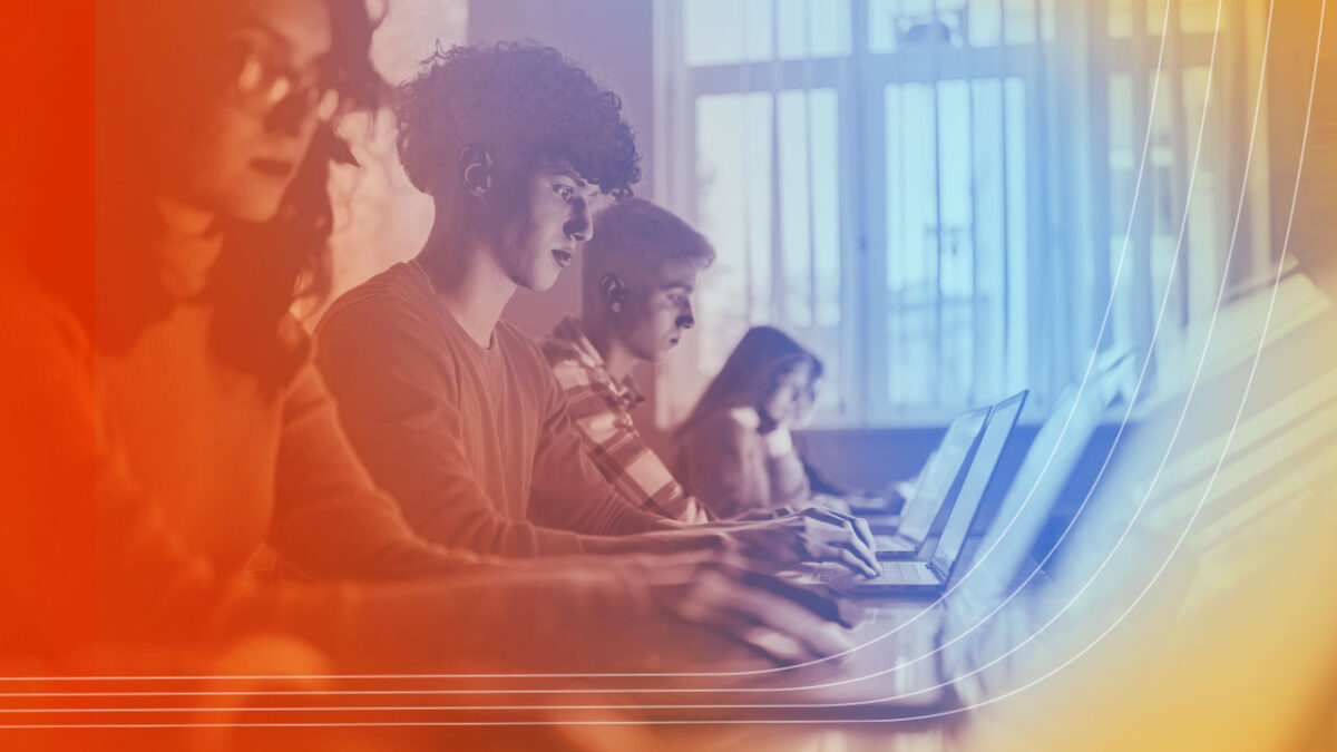 Photo of high school students using laptops in a classroom